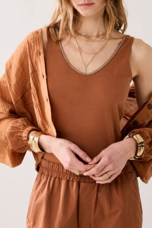 Top reversible con ribete brillante